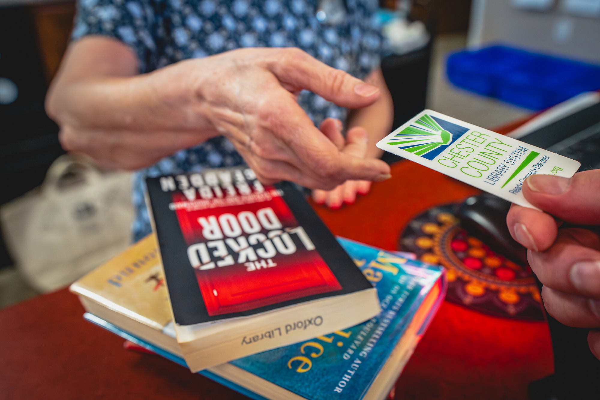 Checking out books with Chester County library card
