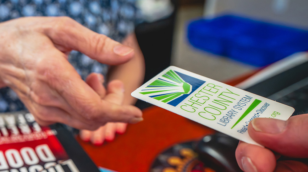 Checking out books with Chester County library card